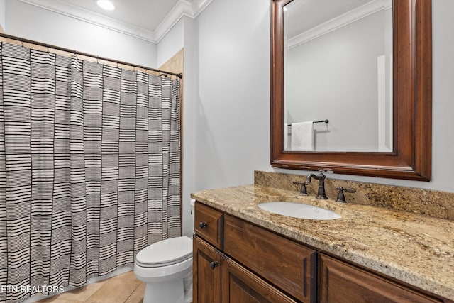 bathroom featuring toilet, ornamental molding, tile patterned floors, and vanity