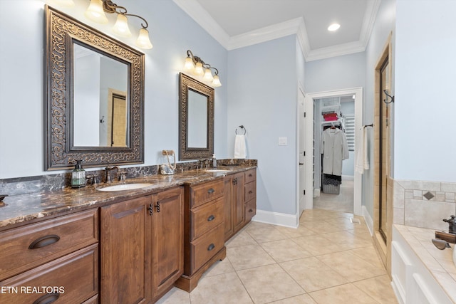 bathroom with vanity, tile patterned flooring, ornamental molding, and plus walk in shower