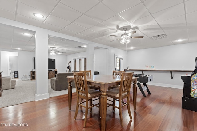 dining area featuring ceiling fan and wood-type flooring