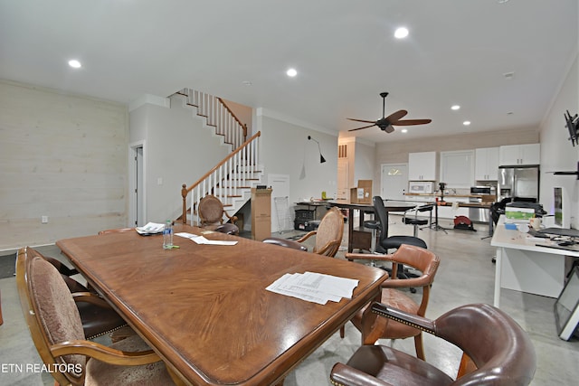 dining room featuring ceiling fan and crown molding