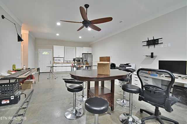 dining space featuring ceiling fan and ornamental molding