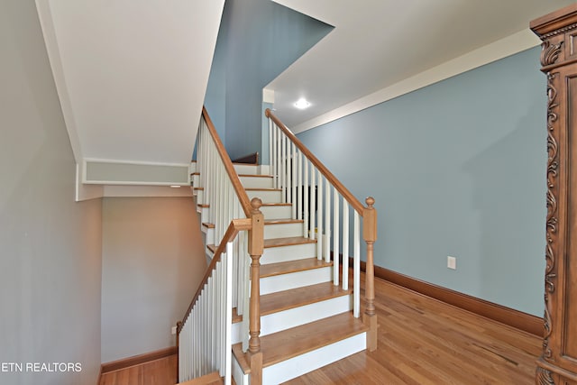 stairway featuring hardwood / wood-style floors