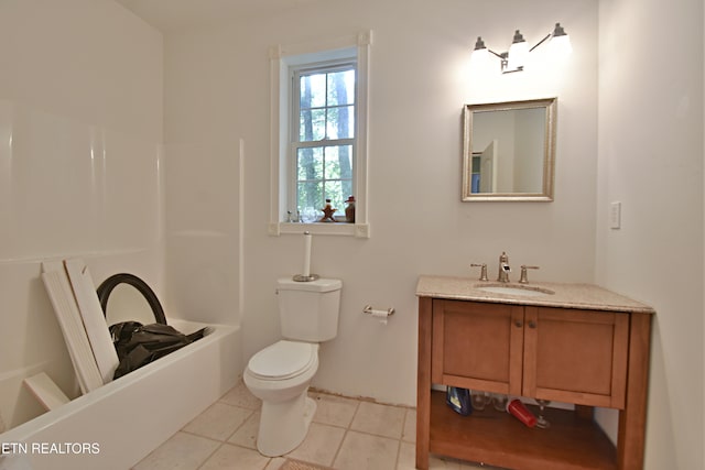 bathroom featuring tile patterned floors, vanity, and toilet