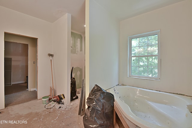 bathroom featuring a washtub