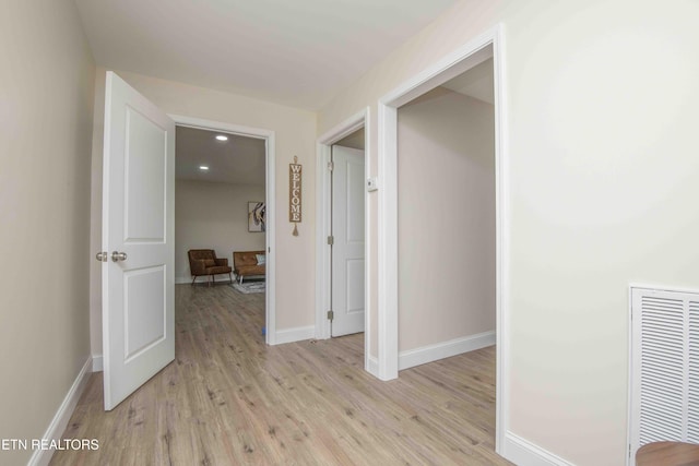 hall with light wood-type flooring