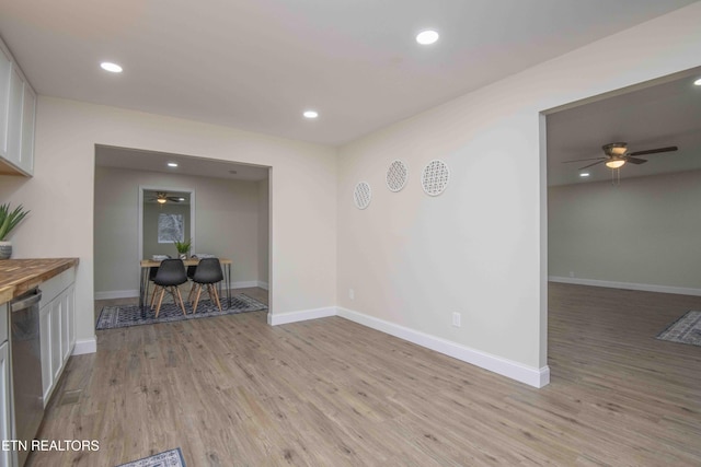 interior space with ceiling fan and light hardwood / wood-style floors