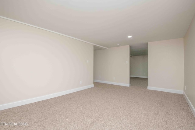 empty room with light colored carpet