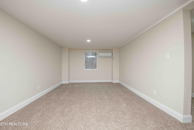 carpeted spare room featuring a wall mounted air conditioner