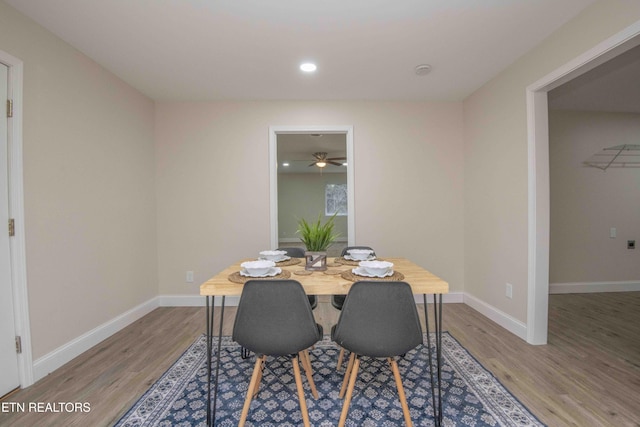 dining space featuring hardwood / wood-style flooring