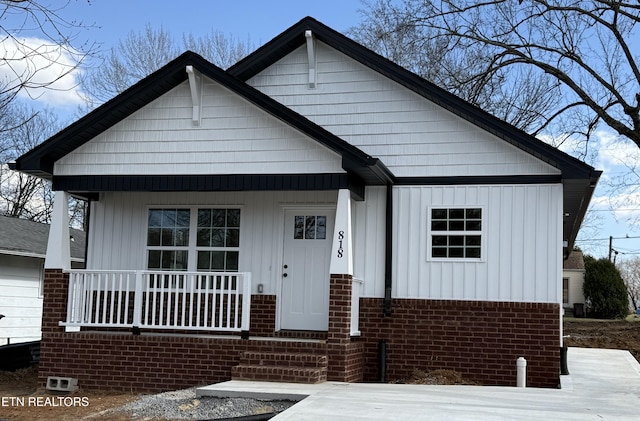 view of front of home with covered porch and board and batten siding