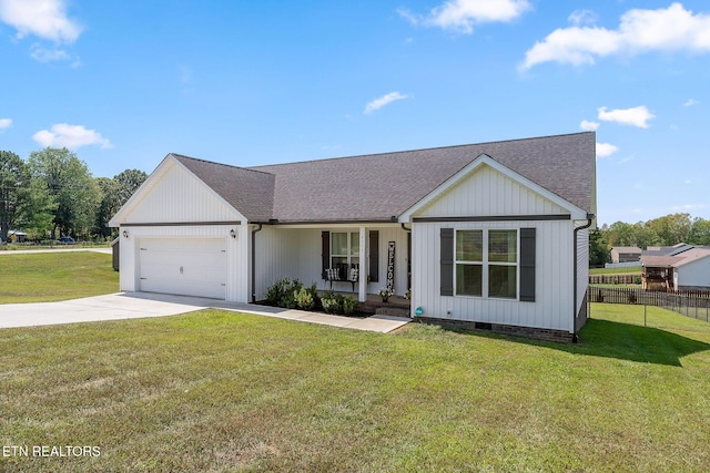 view of front facade with a porch, a garage, and a front yard