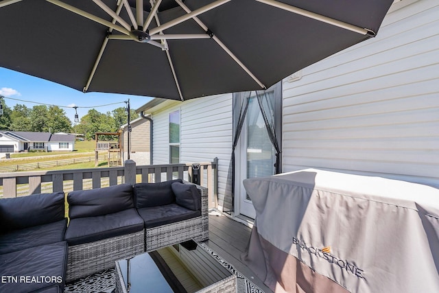 wooden terrace with outdoor lounge area