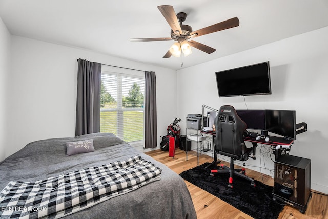 bedroom featuring ceiling fan and light hardwood / wood-style flooring