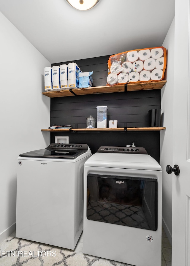 laundry area featuring washing machine and clothes dryer