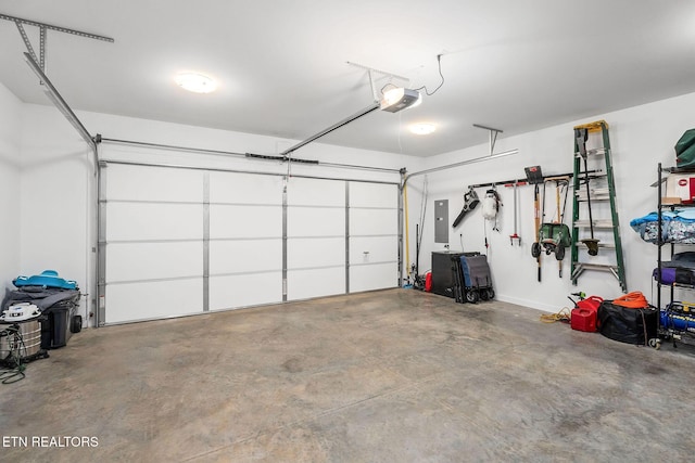 garage featuring a garage door opener and electric panel