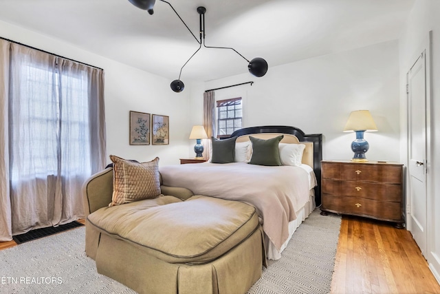 bedroom featuring wood-type flooring