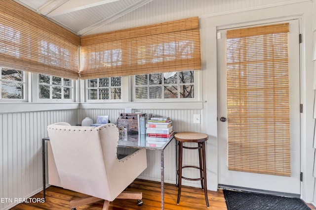 sunroom featuring vaulted ceiling