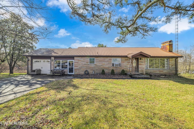 ranch-style house with a garage and a front yard