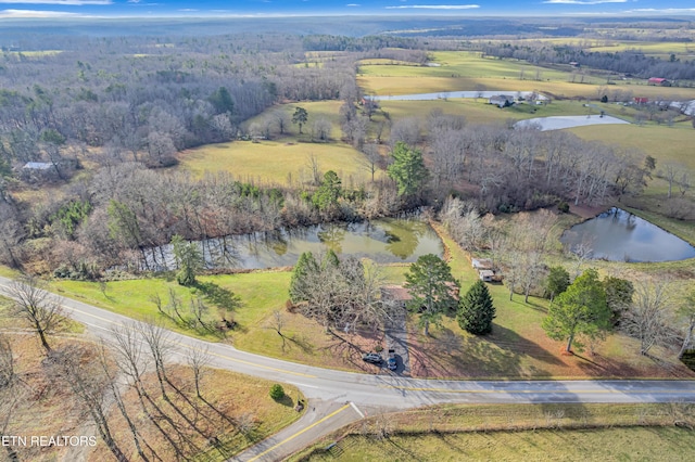 aerial view with a rural view and a water view