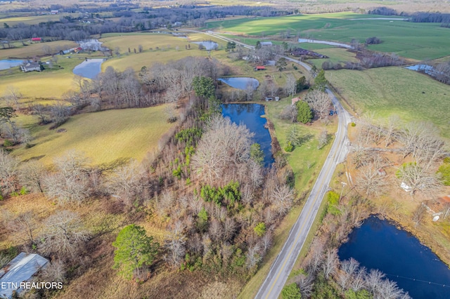 aerial view with a rural view and a water view