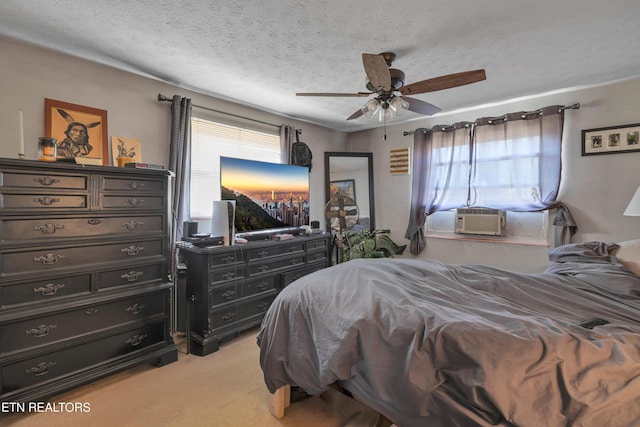 carpeted bedroom with a textured ceiling, ceiling fan, and cooling unit