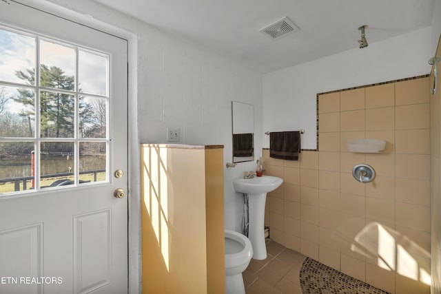 bathroom with tile patterned flooring and sink