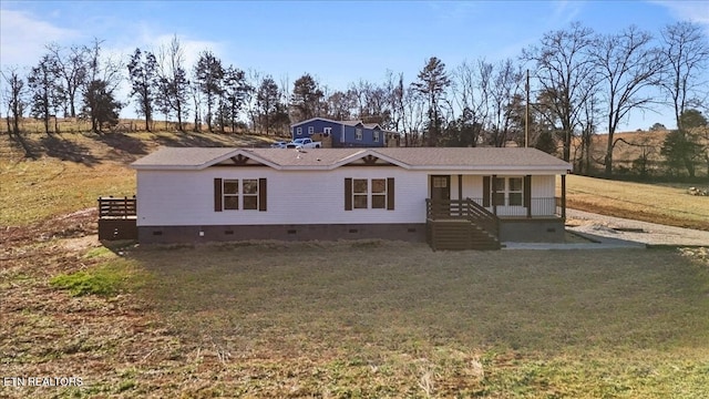 view of front of home featuring covered porch and a front lawn