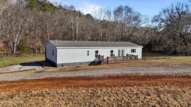 view of front of property featuring a deck