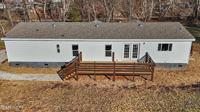 back of house featuring a deck and french doors