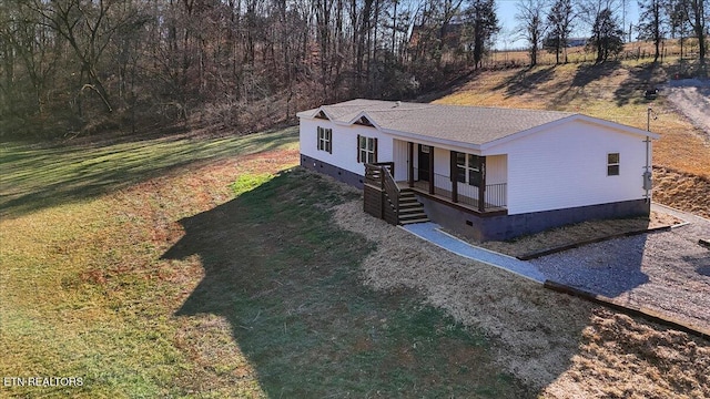 view of front of home featuring a front lawn and covered porch