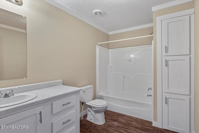 full bathroom featuring a textured ceiling, vanity,  shower combination, hardwood / wood-style flooring, and toilet