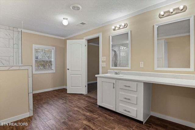 bathroom with vanity and a textured ceiling