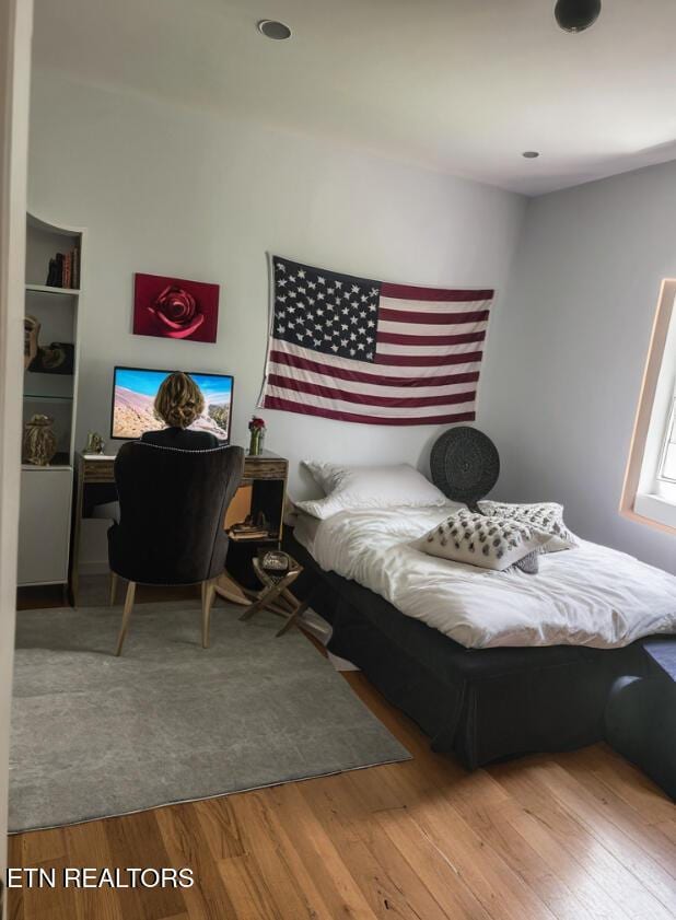 bedroom with light wood-type flooring