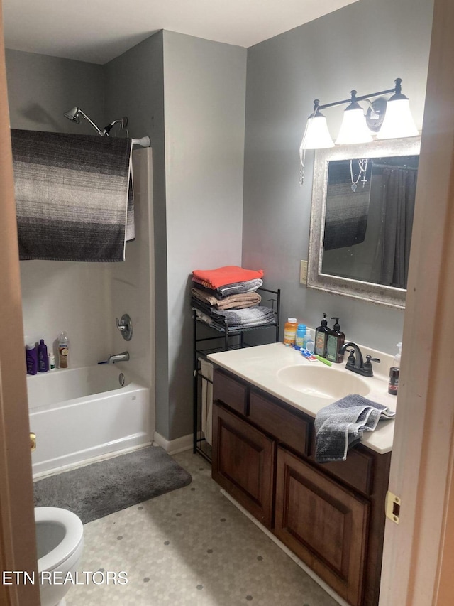 full bathroom featuring shower / bathtub combination, vanity, and toilet