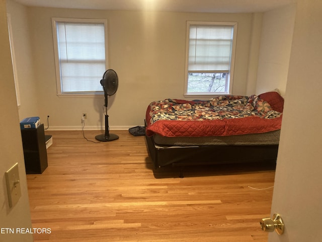 bedroom with light hardwood / wood-style flooring