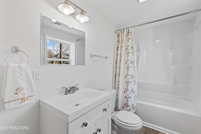 full bathroom featuring vanity, shower / bathtub combination with curtain, and toilet