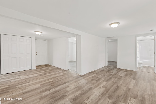 spare room featuring light wood-type flooring