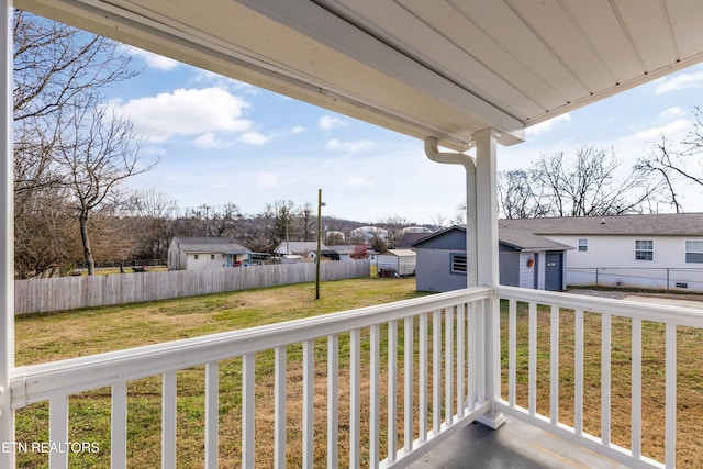 wooden deck featuring a yard