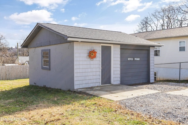 garage featuring a yard