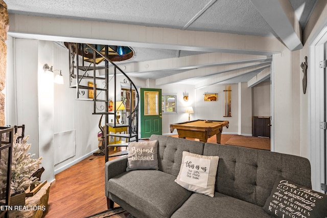 living room featuring wood-type flooring, a textured ceiling, and billiards