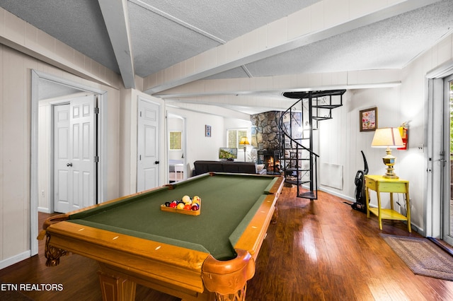 recreation room featuring hardwood / wood-style flooring, pool table, beam ceiling, and a textured ceiling