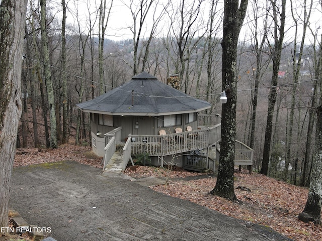 view of front of home with a wooden deck