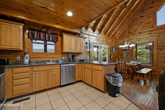 kitchen with sink, high vaulted ceiling, stainless steel dishwasher, a notable chandelier, and light tile patterned floors