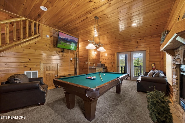 recreation room featuring wood walls, carpet floors, a stone fireplace, billiards, and wood ceiling