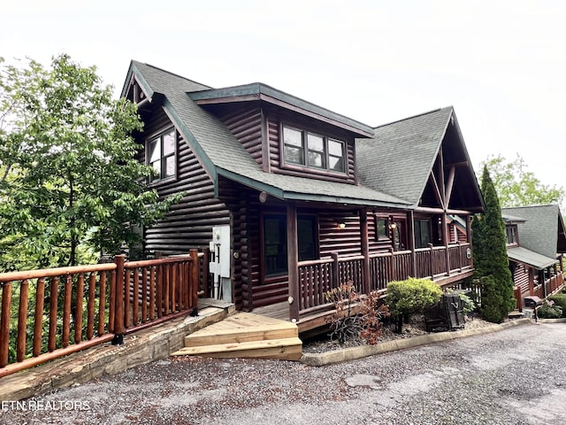 1726 Summit View Way, Pigeon Forge, TN 37862 - view of front of property with log siding, covered porch, and a shingled roof