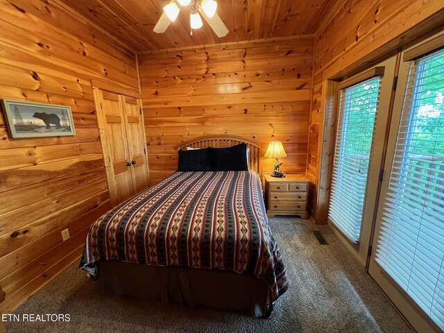 1726 Summit View Way, Pigeon Forge, TN 37862 - bedroom with wooden ceiling, carpet flooring, wooden walls, access to exterior, and ceiling fan