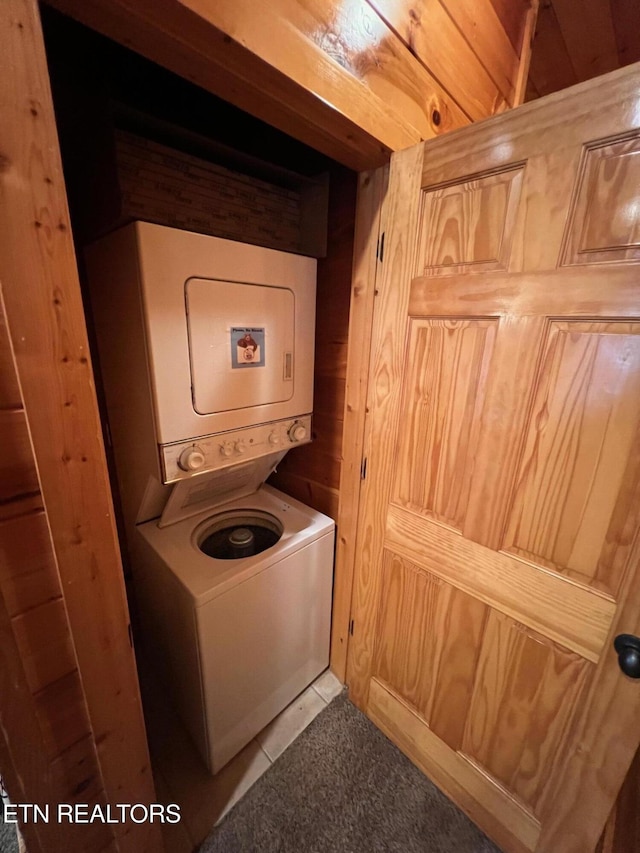 1726 Summit View Way, Pigeon Forge, TN 37862 - laundry area featuring stacked washing machine and dryer and wood walls