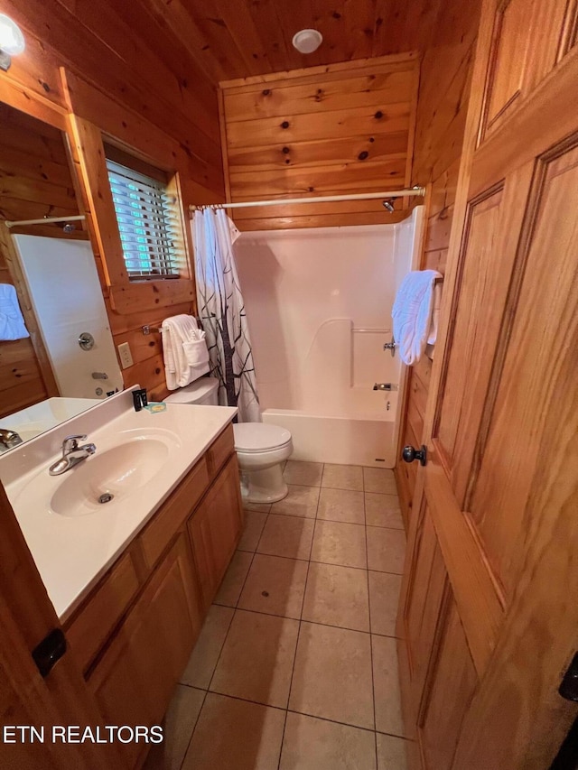 1726 Summit View Way, Pigeon Forge, TN 37862 - bathroom featuring wooden walls, tile patterned floors, vanity, toilet, and shower / bathtub combination with curtain