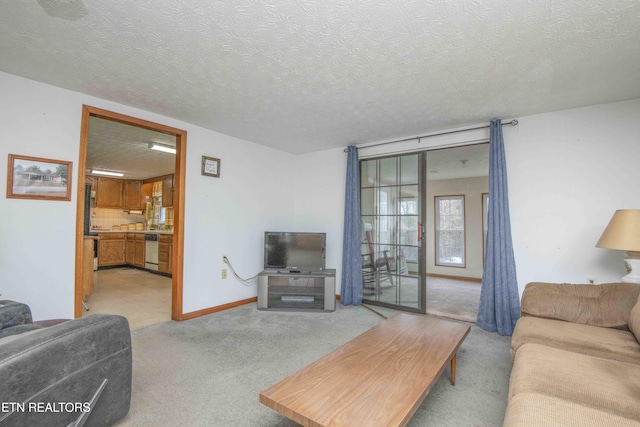 carpeted living room with a textured ceiling