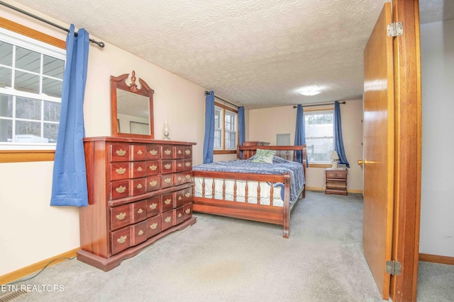 carpeted bedroom with a textured ceiling